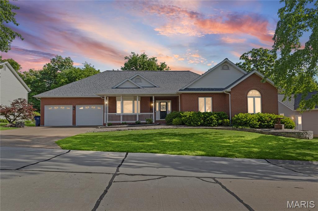 Timeless durability, low maintenance, and timeless elegance define this exceptional all-brick residence at 65 Ashford Place in Festus. Originally built as a builder’s personal home, it showcases an impressive array of quality finishes and thoughtful design throughout.

Offering almost 4,500 square feet of living space, this full masonry home features five spacious bedrooms, three full bathrooms, and one half bath. A formal dining room, currently utilized as a private office, adds versatility to the layout. The expansive living room provides a welcoming atmosphere, highlighted by a gas fireplace and ample space for gathering.

The gourmet kitchen is a true centerpiece, appointed with stainless steel appliances, granite countertops, custom cabinetry, and top of the line built-in oven and microwave. Just off the kitchen, the inviting hearth room creates the perfect setting for casual conversation and connection. A charming breakfast nook with glass doors open into a bright sunroom, blending indoor comfort with outdoor views.

One of the home’s standout features is its exceptional outdoor living space, including a covered 13’ x 24’ composite deck overlooking a fully fenced yard, ideal for both relaxation and entertaining.

The luxurious primary suite offers a private retreat, complete with a spa-inspired bathroom and generous walk-in closets. The finished lower level is equally impressive, featuring a large recreation area with a custom bar, a comfortable family room, an exercise space, and a bonus room suitable for additional sleeping quarters. A private bedroom and full bath in the lower level provide an excellent option for guests or multi-generational living.

Blending quality craftsmanship with functional elegance, this home also includes select accessibility features. Why wait to build when you can experience this level of comfort, style, and sophistication today?

MOTIVATED SELLERS! BRING US YOUR OFFERS :)