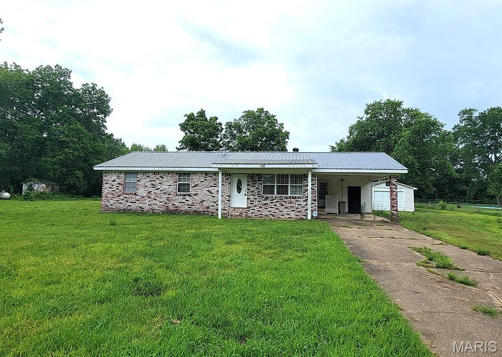 Charming brick home located in the desirable Peaceful Acres Subdivision, built in 1970 and offering 1,280 square feet of comfortable living space. This property features 3 bedrooms, 1½ bathrooms, a one-car attached carport, and a one-car detached garage, all situated on a spacious 1-acre lot. This home is being offered for sale in as-is condition.