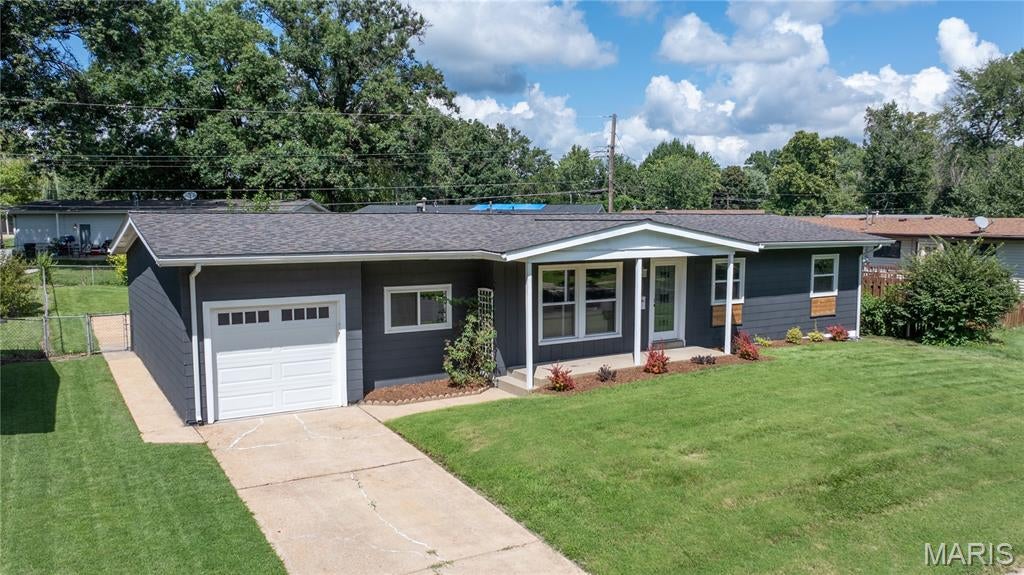 Beautifully renovated home on a quiet street. New construction feel. Over $100k in recent updates. New architectural-shingle drip-edge roof ($11k). New thermal windows ($9k). New 5-panel interior room & closet doors ($2k). New Savana Smooth 80"x30" front entry door ($1k). New furnace ($2,300). New water heater ($2k). New Home Expressions Hearthstone Oak luxury vinyl plank floors ($2,300). Fresh interior/exterior paint. New carpet ($3k). New Patriot light fixtures & Hunter fans. New 5.5" trim & baseboards. New garage door ($1,100). Updated bathrooms with new vanities, tubs, tile, surrounds, faucets, mirrors, hardware, exhaust fans, & toilets. Gourmet kitchen with new shaker cabinetry ($2500), new countertop, new subway tile backsplash, new sink/faucet, and new stainless steel appliances ($3k). Finished lower level with family room, sleeping area, recessed lighting, and storage. Numerous mechanical updates including plumbing & electrical. New door hardware throughout. New closet door slides. New rear window wells. New Google Nest smart thermostat. Covered front porch with new tongue and groove cedar ceiling. Sewer lateral video available. Approved Florissant occupancy.