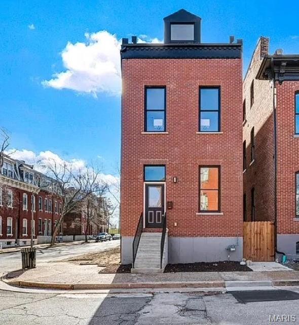 NEW CONSTRUCTION  in the highly sought-after Soulard neighborhood! This stunning three-story home offers 3 bedrooms and 3.5 baths with all-new systems throughout, including electrical, plumbing, roof, furnace, A/C, and water heater. Upon entry, abundant windows flood the home with natural light, highlighting the open-concept main level—perfect for entertaining. The kitchen offers 42" cabinets, SS appliances, and quartz countertops. It opens to a spacious deck spanning the east side of the home, ideal for outdoor living. The second floor features a generous laundry room and two large bedrooms, each with en-suite baths; the second bedroom also enjoys a private deck. The third floor offers an additional bedroom that can easily serve as a home office or flex space. Custom tile work and vanities in all of the bathrooms. Impeccable, luxury finishes are found throughout. Builder is offering a 1-year builder’s warranty for added peace of mind. Close to HWY 40/64, and near all the wonderful shops and eateries of the Soulard neighborhood.