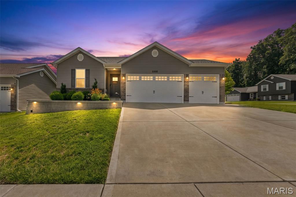 Almost new, stunning ranch home on a corner lot is ready for you to call home. This home has almost every upgrade imaginable!  3 beds, 2 full baths, open floor plan with vaulted ceilings, taller baseboards, rounded corners, wide plank luxury vinyl flooring and plenty of recessed lighting. The spacious kitchen features 42" soft-close custom maple cabinets, granite countertops, stainless steel appliances, breakfast bar and dining area. Sliders off the dining area take you to a huge patio, large fenced-in backyard with gorgeous professional landscaping and beautiful perennial flowers.  The large Primary Bedroom Suite has a walk-in closet, double sink vanity with marble top, luxury whirlpool tub and separate shower.  Oversized 3 car garage with upgraded carriage doors, extra 100 AMP panel, fully insulated and finished with drywall.  Basement is partially finished, with roughed in bathroom and egress window.  Walking path to Indian Camp Creek Park.