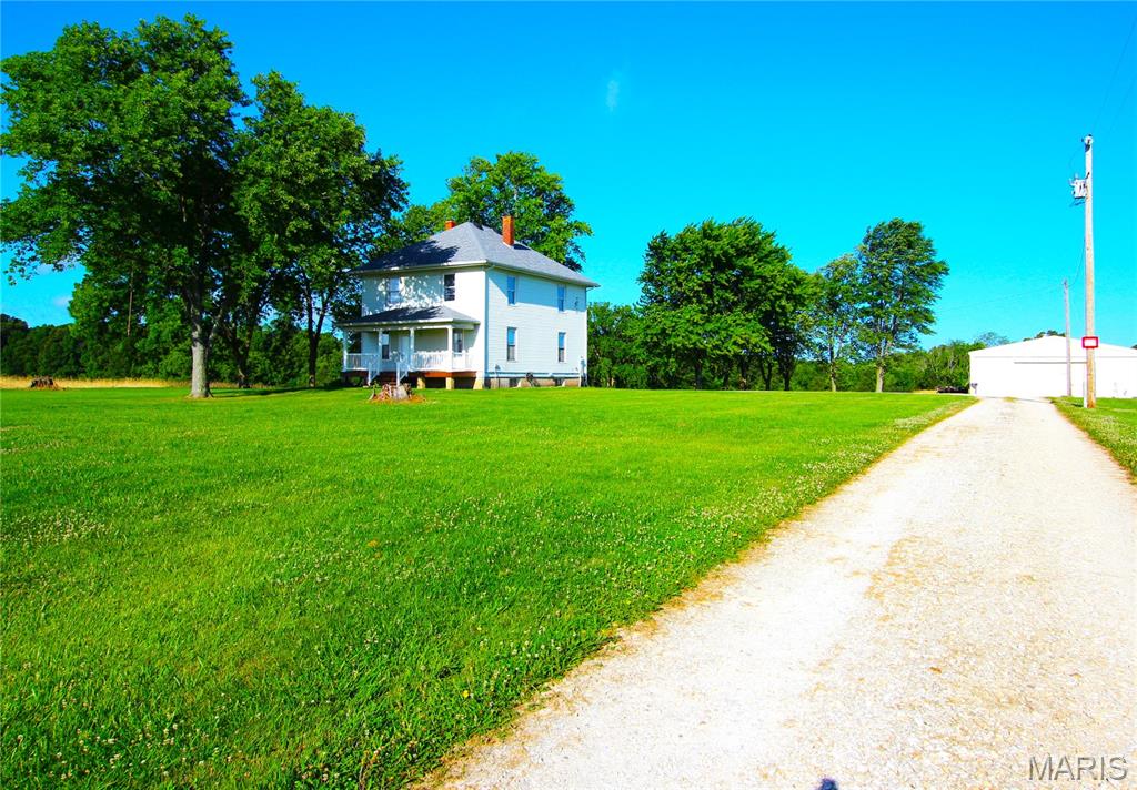 Looking to live in the country with lots of living space to relax and unwind, lots of fresh air and nature. This historical two-story home has been freshly painted, some new flooring, large rooms, 4 beds upstairs along with new full bath and linen closet. Main level has kitchen, newer appliances, breakfast room, living room, den or office with built ins and huge pocket doors. Living room has door to front of house and door to side screened porch and deck. Lots of parking spaces, but no access to garage or pole barn. This is a NO smoking and NO pet property no exceptions. Credit and background checks apply, applications available online, $30 application fee, upload copy of state issued picture ID and proof of income. NO vouchers will be accepted.