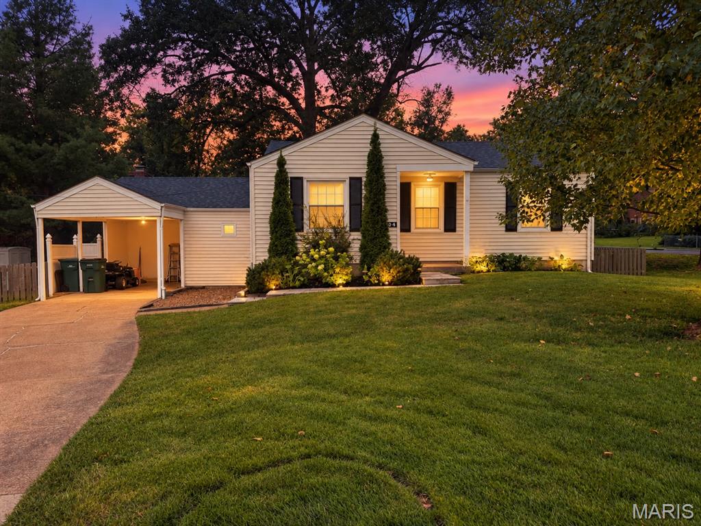Welcome to one of Webster Groves' sweetest neighborhoods, where tree-lined streets and timeless charm come together. Set on a spacious corner lot with mature trees, this charming 2-bedroom, 1.5-bath home offers the kind of location that makes everyday life feel a little easier—and a lot more enjoyable. Just a short stroll from the pool, RecPlex, neighborhood fireworks, and neighborhood schools, you'll love having so much of what you need right outside your door. Inside, hardwood floors flow throughout. Enjoy easy entertaining with the open floorplan. The inviting family room, complete with a cozy fireplace, provides a comfortable gathering space, while the partially finished lower level offers additional room for a playroom, home office, workout space, or whatever fits your lifestyle. An oversized carport and generous driveway provide plenty of off-street parking. With easy access to Highway 44 and all that Webster Groves has to offer, this is a home that combines everyday convenience with the charm of a truly special neighborhood.