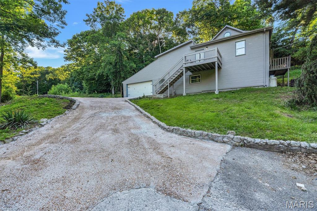 Rare opportunity to own a unique home tucked into the natural beauty of the Castlewood State Park area. Surrounded by mature trees and scenic views, this property offers the feeling of living within the park itself while still enjoying the convenience of nearby amenities. The home features a tuck-under garage and provides a peaceful retreat with breathtaking views and easy access to outdoor recreation.

An exceptional bonus is the inclusion of the neighboring lot at 637, which is included in the sale. This additional parcel offers expanded privacy, added outdoor space, and potential opportunities for recreation, gardening, or future improvements, making this a truly unique offering in an incredible location.

Whether you're looking for a private retreat, a nature lover's paradise, or a home with a truly distinctive setting, this property is a must-see. Enjoy hiking, wildlife, and the beauty of the Castlewood area right outside your door.