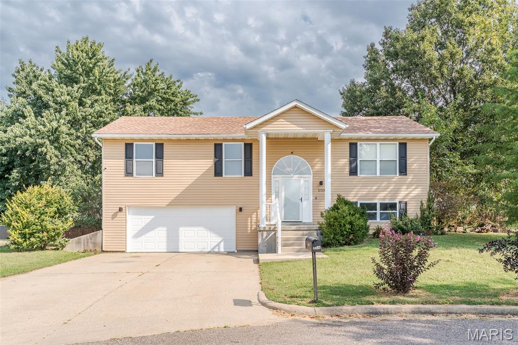 At the end of the cul de sac, this 3 to 4 bedroom home has 3 full baths.  Open floor plan in the living, dining & kitchen area with vaulted ceiling.  Large kitchen island provides plenty of workspace in the kitchen as well as breakfast and convenient when entertaining too.  Dining room provides easy access to the deck for grilling and "chillaxing".  Main floor has 3 bedrooms and 2 full bathrooms.  The finished portion of the lower level has 4th bedroom or family room, whichever you prefer, and the 3rd full bath  Bonus room off the family room would make a great home office or craft room.  Oversized two-car garage, fenced yard, convenient location-- just on the edge of town and yet close to 44 for commuters.  Easy to show!  Schedule you appointment today!