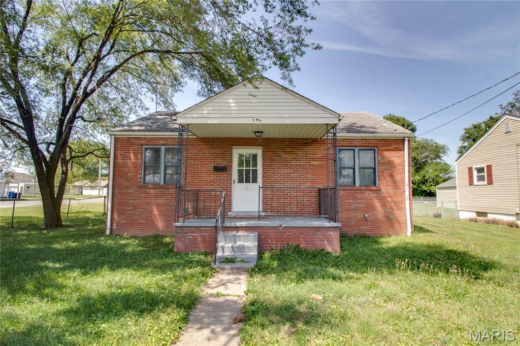 Move-in ready, this recently remodeled 2-bedroom brick home offers comfort, convenience, and character. Situated on a spacious corner lot with alley access, the property features a fenced backyard, perfect for pets or outdoor gatherings. Enjoy mornings on the covered front porch or make use of the detached garage for parking or storage. Inside, you'll find updates throughout and a bright, functional kitchen with appliances that stay. A full basement adds extra space for storage, hobbies. This is a  well-kept home with great curb appeal and a lot to offer!  Agent Owned