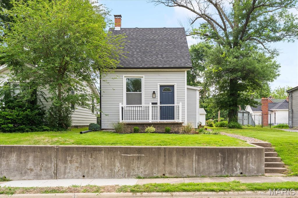Charming 1.5-story home blending timeless character with modern updates! Built in 1912, this beautifully remodeled 2-bedroom, 1-bath home offers 1,183 sq ft of inviting living space filled with original charm and today’s conveniences. Refinished original hardwood floors flow through the living room, dining room, and kitchen, while the spacious upstairs bedroom features brand-new carpet. The second bedroom, located in the rear addition, includes new luxury vinyl plank flooring. 
The fully renovated bathroom shines with updated finishes, and the home also features fresh paint, new appliances, a new roof, and a new A/C system for added peace of mind. Additional updates include some new electrical and plumbing work, plus a new rock driveway accessible from the alley. Outside, you’ll find plenty of space for gardening, entertaining, or simply enjoying the yard.
 In previous listings the dining room was considered a bedroom since it has all the requirements so technically it could be considered a 3 bedroom. Buyers and Buyers agents to verify all data.