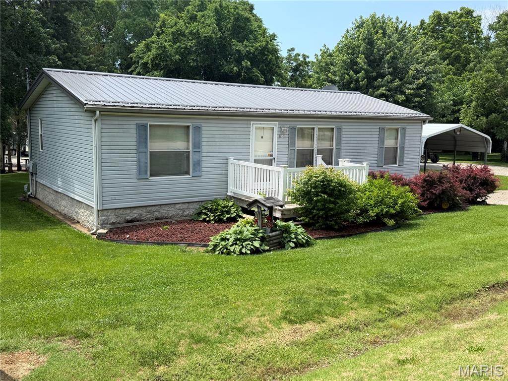 Come check-out this METICULOUSLY MAINTAINED listing that sits on 4 beautiful lots. This 3-bed, 2-full bath manufactured home has been kept-up always. The roof & HVAC has both been replaced in addition to both bathrooms have had recent updates in 2025 with a brand-new water softener system installed in February of 2026. This home has plenty of parking between the carport area, extra-long/wide driveway and the stick built (2x6) detached 30x40 (fully insulated) shop/garage. The garage has 2 -10' tall, insulated doors, 100amp service and the 750 series woodburning stove that'll keep you plenty warm in the cold winter months. The detached shop/garage offers room for your boat, vehicle, SxS and room to entertain!! This listing also has another building/stick-built heated structure that sits in-between the house & garage that has a covered concrete front porch and a firepit just steps away. This building would be great for guest quarters or an additional workshop.  
9014 Beach Dr is a short walk/ride to the pool, main boat docks, rec hall and beach. This listing truly is and has been maintained both inside & out and is ready for the new owner to ENJOY right away!!

Listing to be sold AS-IS, everything is in good working order and has been taken good care of. Potential buyer is welcome to do any inspections they choose for their own informational purposes. 

Set your appointment today...