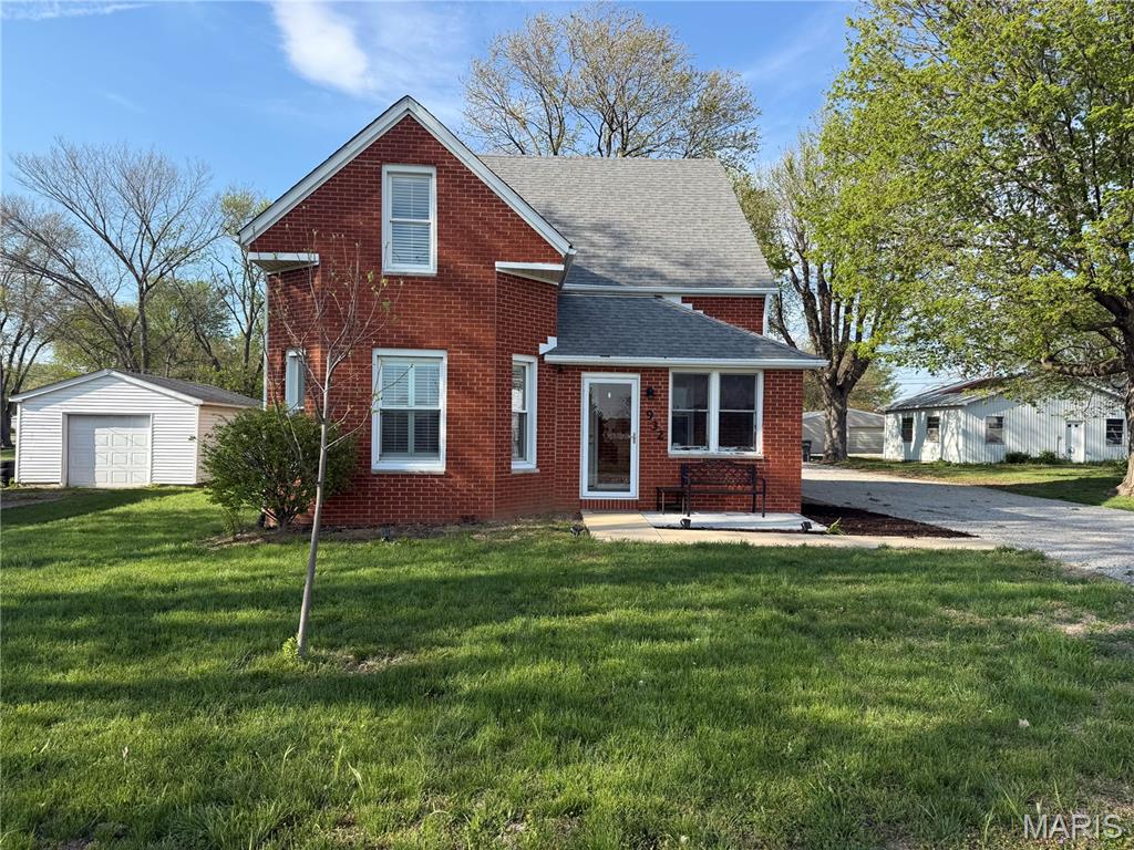 Back on the market due to buyer financing delays. No Fault of seller. 

Welcome home to this charming, well-maintained all-brick property offering over a century of character paired with everyday comfort and livability. Originally built in the early 1900s and thoughtfully updated, this home is truly move-in ready while still offering opportunity for future personalization.

Step inside through the inviting enclosed front porch and into a spacious, functional layout designed for both daily living and entertaining. The main level features a large living room, dedicated dining space, and a well-equipped kitchen with added cabinetry for extra storage. A main floor primary suite with full bath, walk-in closet, and convenient laundry area adds to the home’s practical design.

Upstairs, you’ll find three generously sized bedrooms with vaulted ceilings and a full bath—providing flexibility for family, guests, or home office space. The unfinished basement offers excellent storage with the benefit of a dry, usable space.

Step outside to enjoy the added patio space, thoughtfully designed for outdoor living and entertaining. Whether hosting gatherings, relaxing under the string lights, or enjoying a quiet evening, this space extends the home’s functionality and creates a welcoming outdoor retreat.

Situated on a level lot with a detached two-car garage and workshop area, the property provides both functionality and additional storage options.

Located within the highly sought-after O'Fallon Township High School District and just minutes from Scott Air Force Base, this home offers strong location value with convenient access to shopping, dining, and commuting routes.

A rare opportunity to own a move-in ready home with character, space, and long-term potential in one of the area’s most desirable locations.