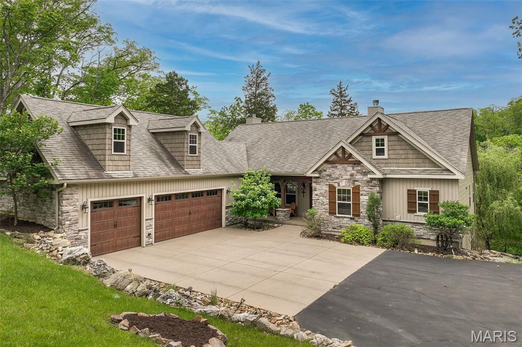 Gorgeous lodge like home with amazing new landscaping including new patio and driveway to Lake Alpine. Welcome home to this stunning, move-in ready (including electric bikes, most furniture & accessories as well as all tools, lawn equipment and water toys). Waterfront home on the shoreline of 200+ acre Lake Alpine @ the Innsbrook Resort Community. 2.2 AC lot w/ 309’ lakefront views, cascading natural rocks on the hillside landscape & an expansive leveled walkway to lakeside dock. Fire pit area, outdoor shower & hot tub. Main level open floor plan w/ hardwood floors & new windows. Stack stone wood burning fireplace is the highlight of the open entertaining space. Chef’s kitchen has stainless steel appliances & an oversized island. Screened-in porch & covered deck offer panoramic views. The primary bedroom ensuite boasts 2 walk-in closets & electric fireplace. An entertainers dream includes lower-level wet bar, in-home theater, pool table, stone fireplace, full bath, 2 bedrooms, 3+ car garage w/epoxy floor & storage space. Unfinished Bonus Room above garage and outdoor shower beneath deck. Wrap up your summer and usher in the fall season while living in this terrific home!