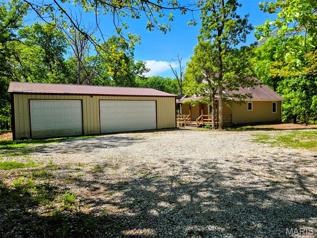 Welcome to your slice of country freedom just minutes from Mark Twain Lake! This well-maintained 2 bed, 1 bath home built in 2013 offers 896 sq ft of finished living space plus a full unfinished basement ready for your expansion or storage needs. Freshly painted and move-in ready, the home also features additional loft sleeping space, perfect for guests or maximizing capacity.

Situated on over 5 acres right next to the desirable Green Ranch subdivision, you'll enjoy the benefits of location without the limitations - NO HOA and NO restrictions. Whether you're looking for a weekend getaway, full-time residence, or investment property near the lake, this one checks the boxes.

The standout feature? A massive 1,200 sq ft detached 3-car garage with a concrete floor ideal for boats, lake toys, or a workshop setup.

If you've been searching for space, flexibility, and proximity to the water, this is it.