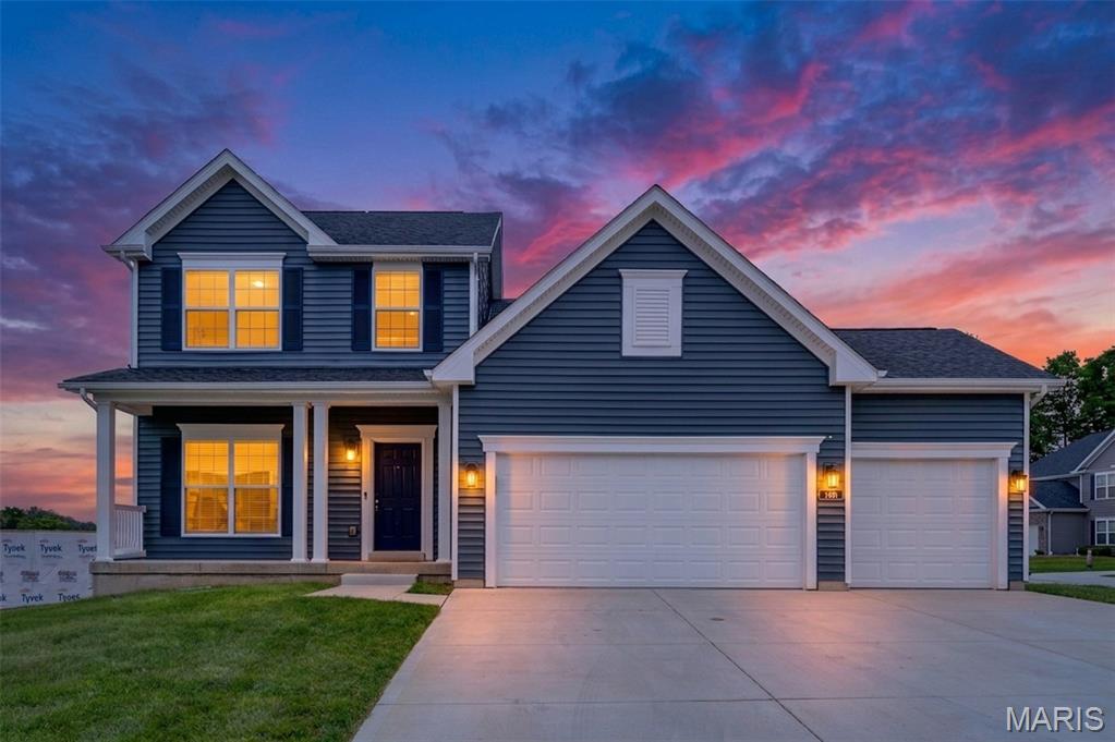 Welcome to 180 Windfall Way, where luxury, quality craftsmanship, and modern design come together in one exceptional home. Why settle for months of construction delays when you can move right into this stunning 3-year-old Consort Homes masterpiece, built by one of St. Louis' premier builders and loaded with upgrades today's buyers desire?

Nestled in highly sought-after Windswept Farms and served by the acclaimed Rockwood School District, this impressive 1.5-story home offers the perfect blend of elegance, functionality, and value. From the charming front porch and three-car garage to the soaring 11-foot ceilings and expansive open-concept design, every detail reflects the superior quality and attention to detail that sets this home apart.

The gourmet kitchen is truly the heart of the home, featuring 42-inch soft-close shaker cabinetry, quartz countertops, a striking 7-foot center island with farmhouse sink, designer tile backsplash, large pantry, and premium stainless steel appliances including a 5-burner gas cooktop, built-in oven, microwave, and downdraft vent. The adjoining breakfast room opens to the patio, creating seamless indoor-outdoor living.

The dramatic great room showcases a wall of windows that floods the space with natural light, while the private main-floor study with French doors provides the ideal work-from-home retreat. The luxurious primary suite offers a spa-inspired bath complete with a soaking tub, oversized glass shower, dual vanities, private water closet, and spacious walk-in closet.
Upstairs, you'll find 3 generously sized bedrooms, a Jack-and-Jill bath, an additional full bath, a versatile bonus room perfect for studying, reading, or gaming.

Freshly painted throughout and featuring brand-new carpeting on the upper level, this home feels better than new. Plus, the unfinished lower level with egress window and bath rough-in provides endless opportunities for future expansion.
Opportunities like this are rare—a nearly new, move-in-ready luxury home from a respected premium builder without the wait, uncertainty, or additional upgrade costs of new construction. Experience the quality, craftsmanship, and lifestyle that make 180 Windfall Way a standout choice in Windswept Farms.