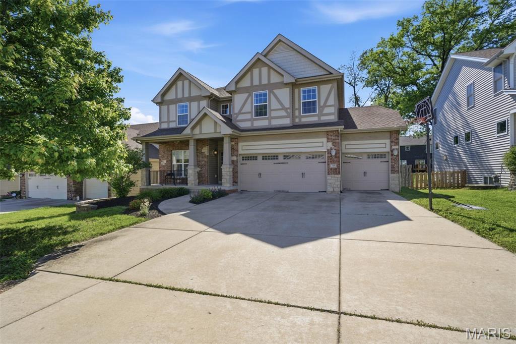735 Harvest Lane is the kind of home that stops you the moment you walk in.

The curb appeal says everything before you even open the door, covered front porch, and a three-car garage with EV charger. This home has been cared for and it shows.

Step inside and the two-story great room sets the tone. Soaring ceilings, a wall of windows, hardwood floors, and natural light that pours through every corner of the main level. The open floor plan connects living, dining, and kitchen in a way that just works, for everyday life and for the moments worth gathering for.

The kitchen is built for real cooking. Granite counters, gas range, stainless appliances, and island seating that keeps everyone connected while dinner is happening. The dining room opens directly to the backyard patio so the inside and outside feel like one continuous space.
Four bedrooms upstairs give everyone room to spread out. The layout makes sense for how families actually live.

The finished lower level is one of the things that sets this home apart. A dedicated workout room, an additional bedroom, a full bathroom, and a flexible family space that can grow and change with you over time. This is the kind of bonus space buyers are searching for and rarely find done this well.

Out back you have a fully fenced yard, a patio ready for summer, and garden beds already in place. Private, functional, and genuinely lovely.
