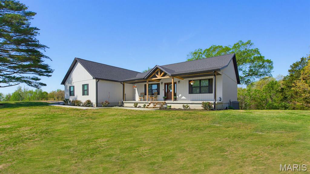 Discover Modern Farmhouse living in this newly built 2024 home with 2x6 walls.  It’s all electric with 9ft ceilings on main floor and in basement.. This thoughtfully designed property features 3 bedrooms and 2.5 baths on the main level, with luxury plank vinyl flooring throughout for both style and durability. The kitchen is equipped gorgeous Rustic Alder cabinets, granite countertops and a spacious walk-in pantry. The primary suite includes a private full bath and a large walk-in closet it also walks out to a covered back deck for a perfect retreat.  The walkout basement provides an additional 1,355 square feet of potential living space. It is framed for 2 additional bedrooms, a full bathroom (with tub and toilet already installed and plumbing in place), a large family/rec room and a designated storage area. With concrete floors, it’s ready to be customized to suit your needs.  The oversized garage is 30x30.  Sitting on 3.4 acres