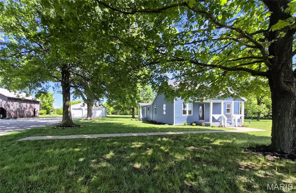 Gorgeous, one of a kind, fully renovated 3 bed, 2 bath historic ranch on an Incredible 3-acre lot!! 

This One of a Kind home combines history and character with modern updates and flare! With just over 2,800 sq feet of living space, wide open lot, and exceptional location, this rare gem will make your heart sing!

Walk into the oversized living room with Beautiful LVP flooring throughout, crown molding, and stylish wood trim and doors. The main living area flows into an updated kitchen featuring 42” cabinets, center island, in-wall oven and microwave, electric cooktop, stainless appliances, and a coffee bar! The breakfast room/dining area is bright and light and walks out to a new deck ideal for everyday living and entertaining. Main floor Laundry!

The spacious primary suite includes a stunning, fully tiled bath with marble floors, an open shower, and dual rain shower heads. The updated, fully tiled hall bath offers a tub and dual vanity. All bedrooms include ceiling fans, solid wood mirrored closet doors, crown molding, and new windows!

Upstairs offers an additional nearly 1,000 sq ft of flexible living space with brand new carpeting, paint and fixtures. IDEAL space for an office, workout area, play room, second living space, potential additional bedroom, or all of the above!

The picturesque lot is truly amazing with 3 flat acres, ready for your horse, chickens, garden, pool, or more!  A 30x30 detached garage with 15’ ceilings, a double and single garage door, full electric panel, and venting for a wood burning stove provides excellent storage, garage, and/or workshop space! The historic barn can be refurbished or parsed out for barn wood. Enjoy your coffee on the covered front porch with porch swing or watch amazing sunsets off the new back deck.

Extensive updates include new HVAC, Roof, Main Floor Windows, Siding, Septic System, Plumbing, Electrical, Panels, Flooring, Paint, Fixtures and More!