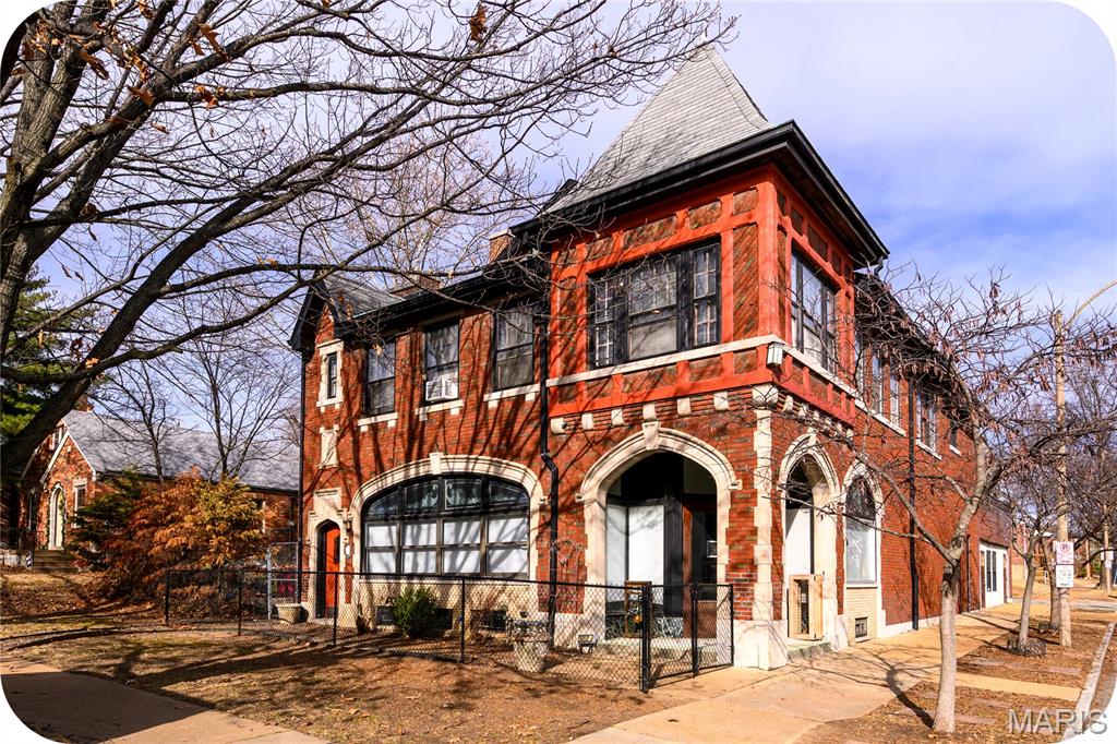 A rare opportunity to own an impressive historic brick mixed-use, multi-family building offering outstanding flexibility, income-generating potential and an included 3,382 SF side lot. This architecturally distinctive property is comprised of 2 spacious units and will be delivered completely vacant at closing, offering a true blank slate for investors, owner-users or live/work buyers. The 2,207 SF main-level unit was most recently used as a daycare and features a welcoming front reception area, 3 large and flexible rooms, 1 full and 1 half ADA-compliant restroom, a large stainless-steel commercial kitchen and storage space. The layout easily supports a variety of uses including office space, salon or spa, child or adult daycare, wellness services, doggy daycare, retail or a live/work residence. The adaptability of this space truly invites you to bring your imagination. The upper-level unit is a full apartment offering 2,527 SF of living space with a private entrance. The space offers a full kitchen, 4 bedrooms and elegant French doors opening to a light-filled sunroom that can serve as an office or 5th bedroom, highlighted by terrazzo floors and expansive windows. Highlights include 2 full bathrooms, a spacious living room, dining room and a large laundry room/den that leads to a private rooftop balcony just perfect for container gardening, BBQs and relaxing outdoor enjoyment. The building also offers a full basement with ample storage. The 1,000+ SF attached 5-car garage has been converted into a combination of finished and unfinished storage spaces but can easily be restored to garage use if desired. Off-street parking for 3 vehicles is available via the alley. Included in the sale is the 31’ x 109’ side lot, ideal for green space, expansion or the addition of a large garage or other improvements. Located in the highly desirable Northampton neighborhood, this property is a short walk from The Golden Hoosier, Bud’s Pizza, Piper’s Tea & Coffee and so much more. With its size, flexibility, additional land and vacant delivery, this property presents a truly unique opportunity with limitless potential.