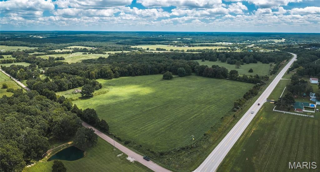 Price Reduction!! The possibilities are endless with this beautiful 34.66 acre m/l property located just outside the Rolla City Limits! Offering the perfect combination of convenience and peaceful country living, this exceptional tract features both Highway 72 and County Road 4080 frontage. Whether you're searching for the perfect place to build your dream home, establish a hobby farm, create a private hunting retreat, or simply enjoy your own slice of the Ozarks, this property is ready to bring your vision to life. This land offers a wonderful blend of open pasture and mature woods with perimeter fencing already in place. Wildlife enthusiasts will appreciate the abundance of deer and turkey, while nature lovers will enjoy the scenic landscape, beautiful mature trees, towering pines, and a unique year-round spring-fed pond that adds to the property's natural beauty.  Enjoy the privacy and relaxed pace of country living without sacrificing the convenience of being just minutes from shopping, dining, and every day amenities. Schedule your private tour today and experience everything this remarkable property has to offer!