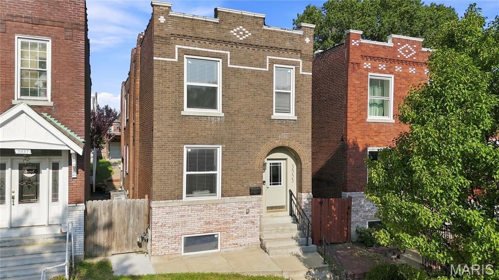 It's true! You can actually get into a gorgeous and large renovated house in Tower Grove South for an affordable price. Wait until you see the open living space and soaring ceilings with crown molding and recessed lighting, you won't believe your eyes. The kitchen is simply incredible. There are so many cabinets and luxurious marble countertops, upscale appliances, tile backsplash, pantry and huge center island with breakfast bar. This home was a complete renovation is 2020, so everything inside is nearly new, you'll have maintenance-free living for many years to come. Upstairs are 3 bedrooms including the primary suite with walk in closet and stunning bathroom with a huge custom shower. The hall bath is equally as striking featuring a double vanity with marble tops and tiled floors and shower surround. Convenient second floor laundry too. Nice woodgrain floors throughout - no carpeting here! Outside you'll find a deep and fully privacy fenced yard, patio and 2 car garageport with opener and brand new garage door. Updates include: Zoned heating and cooling '20; windows with blinds; all modernized electric, plumbing, ductwork, sewer, fixtures. This impressive home will make you the envy of all your friends. Don't miss this unbeatable value in this vibrant and walkable community.