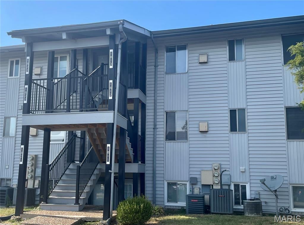 Enjoy summers on the lake in this immaculate second-floor condo within the Lake St. Louis Community Association, offering full lake rights and access to an impressive range of amenities. Lake rights may be assigned to a tenant if the property is used as a rental. This move-in ready home features convenient one-level living, a new HVAC system, new carpet, a new oven/range, a brand-new deck, fresh paint, an updated bathroom, assigned parking, and an on-site laundry facility. Skip the yard work and spend your time enjoying the lake, parks, trails, pool, Par 3 golf course, clubhouse, restaurant, meeting rooms, and scenic community views. Located in Mystic Village, this condo offers easy access to Hwy 70 and 40/61. Visit lslca.com for more information about Lake St. Louis Community Association amenities.