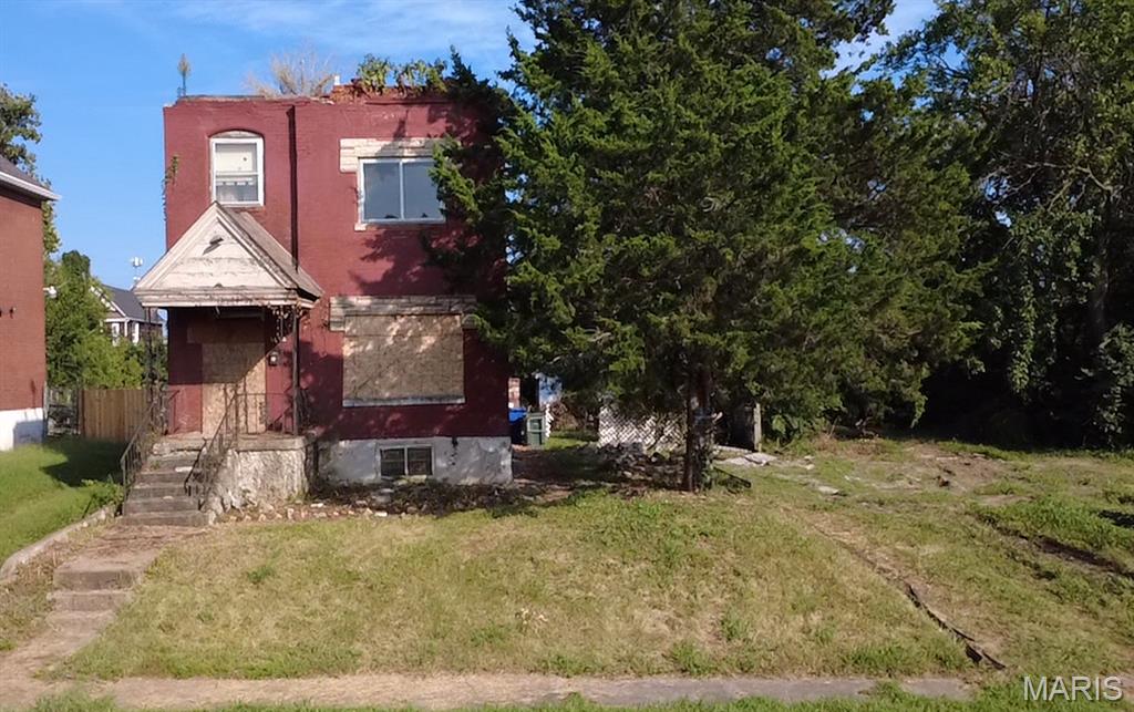 ATTENTION INVESTORS! This is THE ONE - Historic two story brick charmer with an oversized garage on a large lot! Great location, close to all St Louis sights, new NGA Campus, shopping, restaurants, highways and all other amenities!  Bring this great sized 2 story home back to its beauty. OR build a brand new investment - The minimum buildable lot size in St. Louis City is 2,000 square feet for single-family homes and 1,250 square feet per unit for two-family homes. This lot offers 7,750 sqft! This is an awesome buy for investors or a homeowner occupant with a vision! Great investment opportunity - could be a tear down rehab it's current structure and bring it back to life. Tons of brick could also be used to re-sell. STL City has lots of opportunities for investors - this property may qualify for credits/ benefits due to its location. Opportunity Zones are economically-distressed areas where new investments may be eligible for preferential tax treatment. Utilize the large lot and make it cash flow again. Last chance to make a smart investment move this quarter/ end of year. Priced to sell, Full Gut Rehab. CALL NOW
