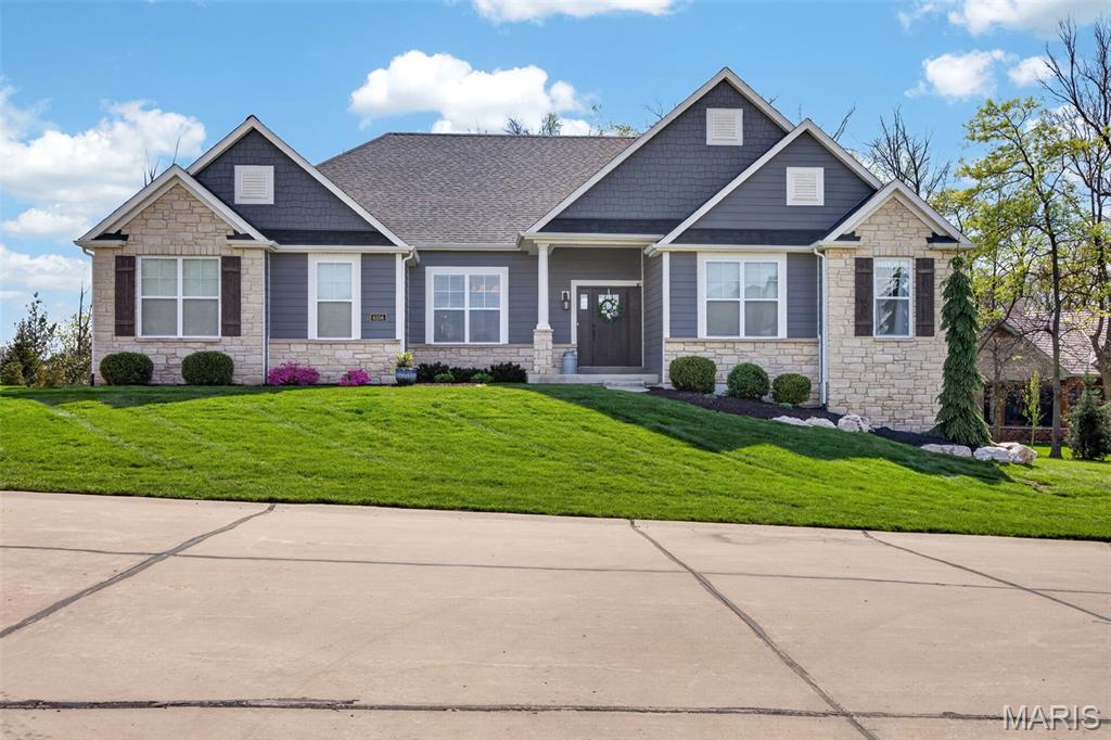 Welcome home to this stunning open-concept ranch in the prestigious Bluffs At Windcastle neighborhood that perfectly blends upscale design with everyday comfort. 

This beautifully designed 5-bedroom, 3 full and 2 half bath home offers a spacious, light-filled layout ideal for both entertaining and relaxed living. Step inside to find rich hardwood floors, soaring 11 and 9 foot ceilings, and a thoughtfully curated interior featuring designer touches throughout. The expansive great room flows seamlessly into the gourmet kitchen and dining area, creating the perfect gathering space. The kitchen boasts ample cabinetry, a large center island, and an abundance of prep space for hosting with ease.
Buyers got cold feet- no fault of sellers! Clean inspection complete and available upon request. Sold the first day on market- do not miss your second chance!

The main-level primary suite provides a private retreat with a spa-like en suite bath and generous closet space. Two additional main floor bedrooms offer flexibility for family, guests, or a home office. A formal dining room on the main level also provides you with the opportunity to entertain guests around a table or in a sitting room, or use the space for an office complete with beautifully handcrafted chevron doors for privacy.

The finished lower level expands your living space with two additional bedrooms, a full bathroom including a double vanity, a theater room and a large flex space with wet bar to entertain or unwind.

Step outside to your own backyard oasis—complete with a covered patio featuring a gas fireplace and half bath to make entertaining a breeze. The less than 1 year old resort-style fiberglass pool with auto cover, tanning ledge and stone fountain provides the perfect setting for all your summer gatherings with family and friends. The screened in deck provides shade and protection and will be everyone's favorite spot. All that's missing is your spa, which already has a reinforced patio and electric ready to go. 

Situated close to 364 in desirable St. Charles, this home combines luxury, functionality, and exceptional outdoor living. Don’t miss your opportunity to own this one-of-a-kind property—schedule your private showing today!