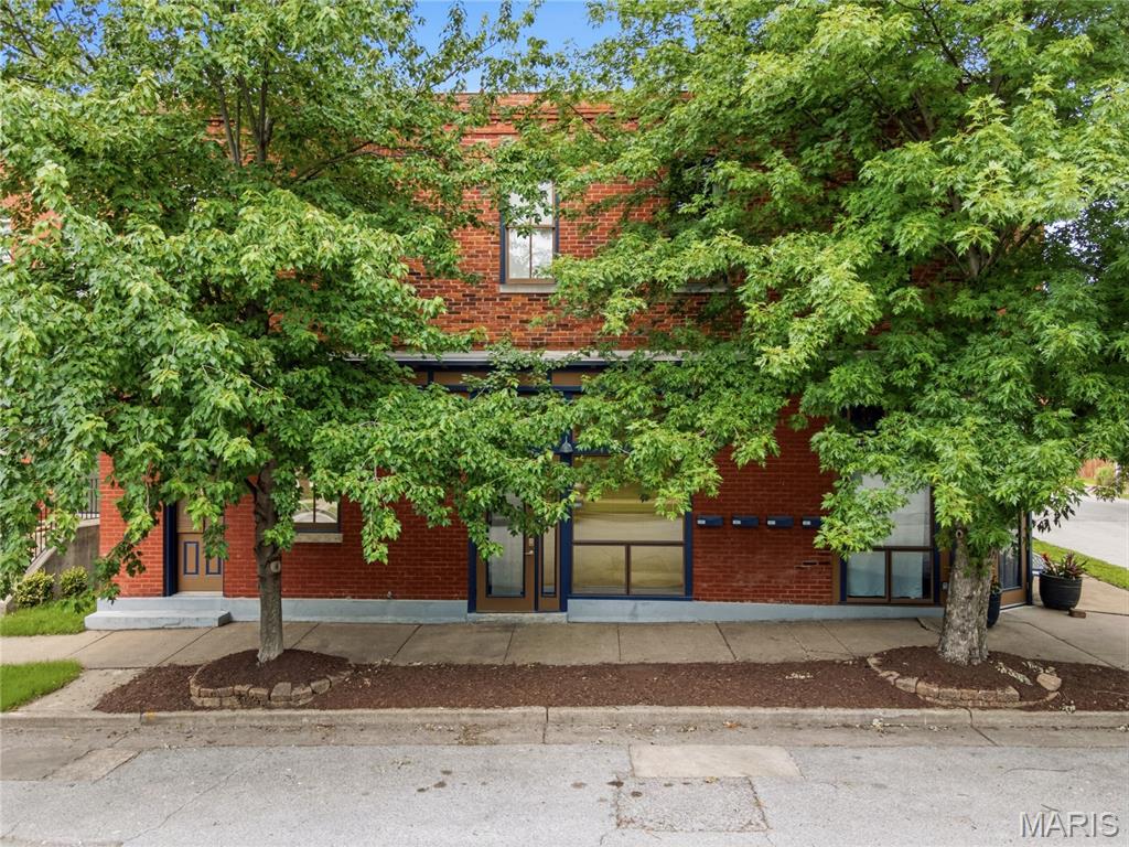 Built in 1884 and beautifully preserved, this Benton Park condo delivers all kinds of character with soaring vaulted ceilings, exposed brick, and hardwood floors that set the stage the moment you walk in.
The open, sun-drenched layout makes everyday living feel effortless, while large windows pull in natural light that makes the space feel larger than its footprint. In-unit laundry, off-street parking, and dedicated storage check the practical boxes without sacrificing an ounce of style.

Step outside and you're in the heart of one of St. Louis's most walkable, vibrant neighborhoods. Blue City Deli, Sidney Street Café, Peacemaker, Arzola's all within easy reach. Soulard is practically next doo and Cherokee Street's dining, art, and nightlife scene is right around the corner. Quick access to I-55 and I-44 makes the rest of the city just as easy.

Whether you're planting roots or adding to your portfolio (rentals permitted), this one checks every box!