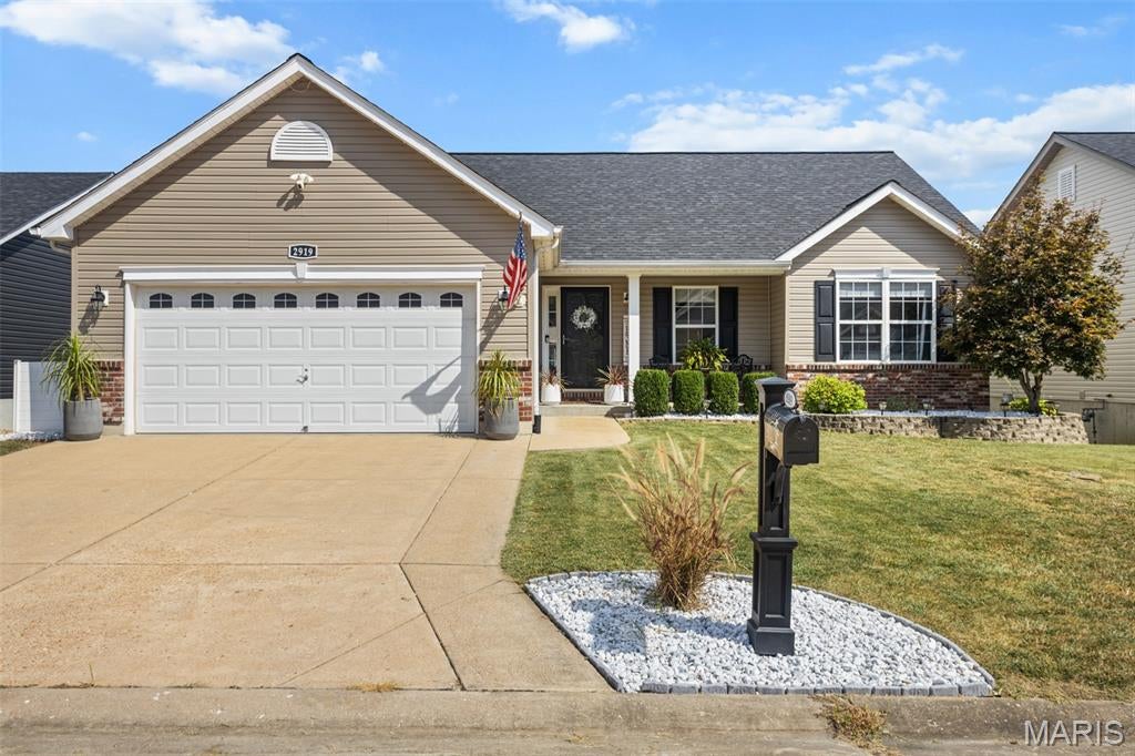 Welcome to this beautifully updated 4 bedroom 3 full bath home with a view of the lake!  The first thing you will notice when entering the home is the open floor plan and soaring vaulted ceilings in the  main area.  A great room with electric fireplace, kitchen with plenty of storage and counter space for making your favorite recipes.  The dining area is just off the kitchen with large sliding glass doors that draw you out to the roomy deck.  The deck boosts a view of the lake that is so serene and just perfect for enjoying your morning coffee or a quiet dinner!  Back inside you will find 3 bedrooms on the main level including the primary suite complete with vaulted ceiling, walk in closet and bath with both shower and separate deep soaking tub.  Downstairs the lower level has been finished out with a gas fireplace, full bath, bedroom ( Also with view of the lake) and wet bar area, storage and walk out to a shaded patio and fenced landscaped yard.  Open house soon!