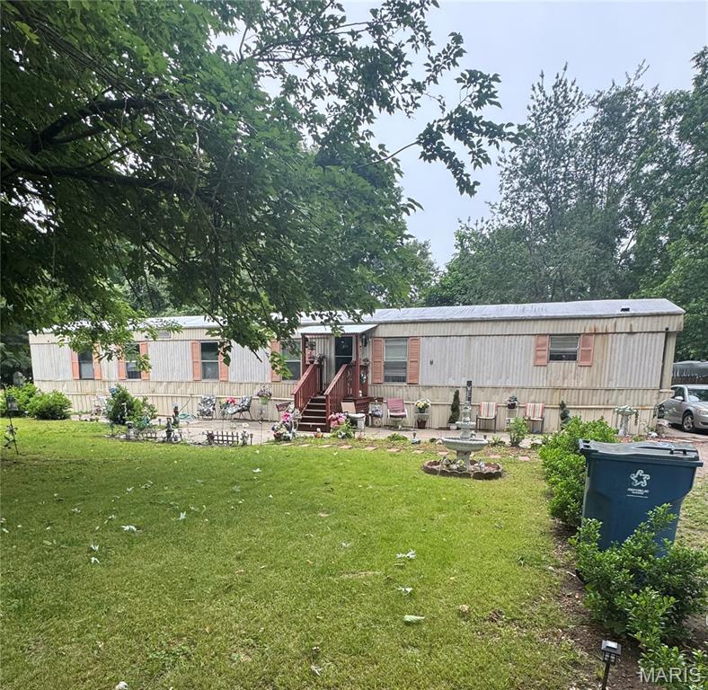 Nice mobile home in residential area. Home has been been well maintained.  Three bedrooms and two baths.  Double closets in master bedroom. Large lot with lots of shade trees. Back yard has privacy fence. Deck in back. Storage shed stays. Large kitchen with lots of cabinets. Snack bar. Stove and refrigerator stay.
