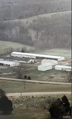 Discover the possibilities with this 7.6-acre property. Whether you're looking for a weekend getaway, a place to enjoy the outdoors, or room for your ATVs, UTVs, and recreational equipment, this property has it all. The mostly level parcel features excellent highway frontage for easy access and is partially fenced. Multiple outbuildings, including two machine sheds and two additional farm buildings, provide ample space for equipment, storage, hobbies, or agricultural use.