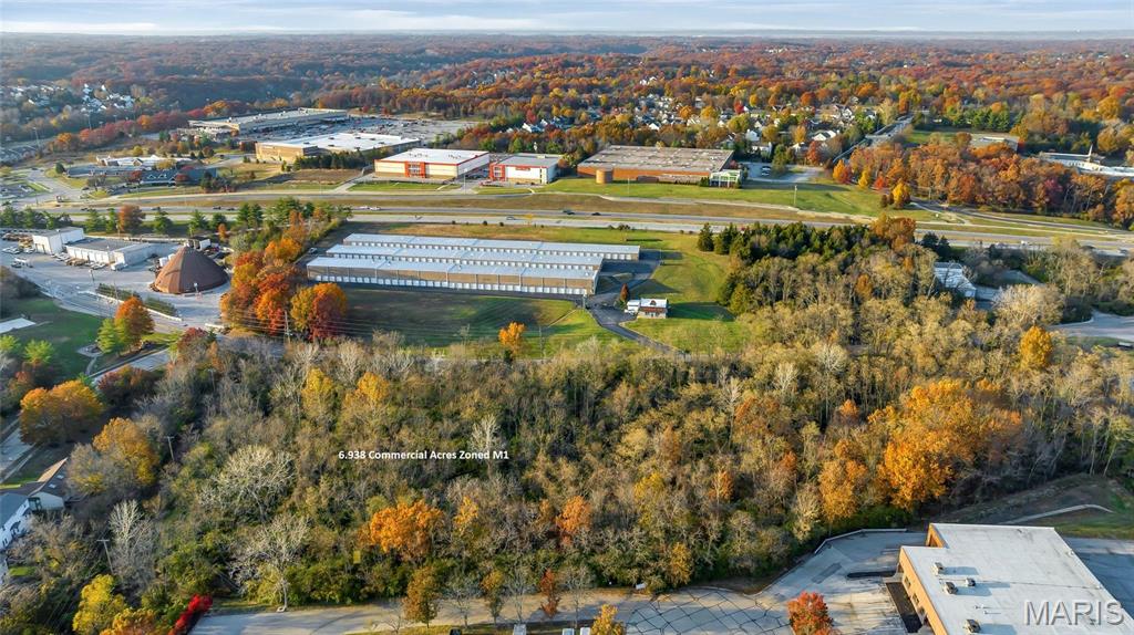 6.9 acres of vacant land adjoining commercial, light industrial,and residential properties.  Easy access just off Manchester Rd in Ellisville. Stop light access at Manchester & Ruck. Location: City, Industrial Area, Suburban