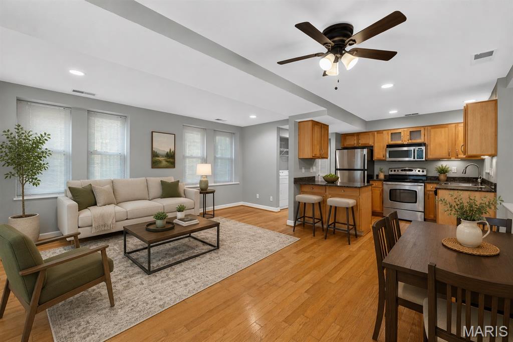 Look no further for the perfect condo- Welcome to 5360 Pershing! This meticulously maintained 1 bedroom/ 1 bathroom unit offers a bright open floor plan with updates throughout. New in-unit washer/dryer, updated systems, stainless steel appliances, fresh paint, and more! Natural light fills the living/dining area, making you (and your plants) feel right at home. No matter your skills in the kitchen, the fully equipped setup is perfect for cooking, entertaining, and even just enjoying your morning coffee at the peninsula bar. 
Down the hall, a linen closet, utility closet, and an oversized full bathroom, offering an enclosed shower/tub combo and plenty of storage shelves tucked in the corner. The bedroom features new sparkling LVP flooring and a large walk-in closet. No condo is complete without outdoor space, and this unit has its own deck off the bedroom, perfect for grilling and enjoying some fresh air! To make things even better, the assigned parking spot in the secure, gated lot is the closest one from the front door and the private storage unit is the first you will see in the basement, adding convenient extra space to store the overflow. A true hidden gem in the Central West End/ DeBaliviere Place- beautiful tree lined streets and close access to Forest Park, hospitals, universities, and some of the best restaurants and entertainment the city has to offer. You won’t want to miss this!