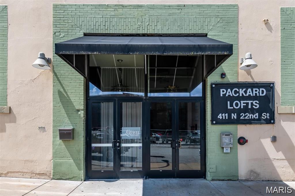 Welcome to Unit 201 at the historic Packard Lofts, a stunning 2-bedroom, 1-bath condo offering 1,180 square feet of authentic loft living in the heart of Downtown St. Louis. Built in 1914, this light-filled home blends historic character with modern style, featuring large eastern-facing windows, polished concrete floors, exposed brick walls, and an open-concept living and dining area. The modern kitchen flows seamlessly into the main living space, while the long gallery-style hallway provides the perfect place to display artwork or add your own personal touch.

The spacious living room opens to a private balcony, ideal for enjoying your morning coffee or unwinding after a long day. Both bedrooms are generously sized with ample closet space, and additional conveniences include in-unit laundry, central air, elevator access, insulated windows, and one assigned attached garage parking space.

Location is everything, and this condo puts you minutes from the best of city living, including Energizer Park, home of St. Louis CITY SC, St. Louis Union Station, the St. Louis Wheel, restaurants, entertainment, and more. With nearby public transit and convenient access to Downtown, Midtown, and major highways, this home offers the perfect combination of space, character, convenience, and location. Don't miss your opportunity to own a distinctive piece of St. Louis history. Schedule your private showing today!