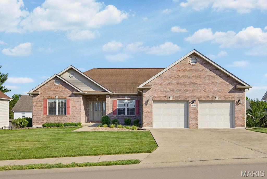 Schedule your tour of 1835 Evondale today! The home features a split bedroom layout with 4 bedrooms, 3 full bathrooms, main level laundry, a designated dining room, a primary suite and a full basement with an abundance of storage.  The open living room showcases wood floors, a cathedral ceiling and is centered around a gas fireplace with windows on each side giving a view of the oversized deck.  The eat-in kitchen includes a full range of appliances, granite countertops, stone tile flooring and backsplash, a breakfast bar, large windows and sliding doors allowing an abundance of natural light. . In addition to the covered outdoor deck that can be accessed from the kitchen, you will find a covered patio below that’s perfect for entertaining or just enjoying a peaceful afternoon/evening.  Walking downstairs to the full walk-out basement you will find a large Living room, full bath, a bedroom, a bonus room, and an extended John Deere room with a shop area.  The bonus room has a concrete storm closet and offers access to additional storage room. This property would be a remarkable place for you to call HOME!