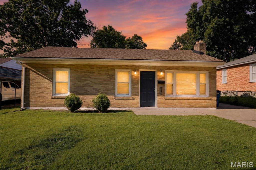 Single-story conventional ranch home situated within the Ritenour School District footprint. This 912 sq. ft. residence features a functional main-level layout with 3 bedrooms and 1 full bathroom. The interior floor plan includes a primary living area, an adjacent kitchen space with dedicated utility hookups, and a full unfinished basement providing extensive storage capacity or future expansion potential. Mechanical systems feature forced-air heating and central cooling components. Exterior attributes include traditional frame construction, a 1-car attached garage with driveway parking, and a level 0.17-acre rear yard layout. Conveniently located with straightforward proximity to local public parks, Lambert International Airport, and major regional transit corridors.