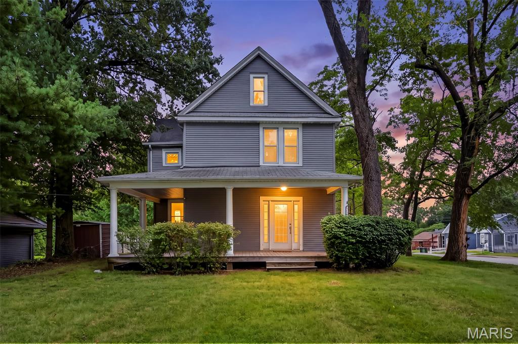Charming historic farmhouse offering character, space, and privacy on a large corner lot! The inviting wraparound porch and back deck provide plenty of room to relax or entertain. Inside, you’ll find original hardwood floors, a spacious living room, formal dining room filled with natural light from the bay windows and beautiful shutters. A bonus room on the main level offers flexible space for a home office, den, or playroom. The kitchen features abundant cabinet & countertop space with a huge pantry. Main-floor laundry adds convenience and an additional area with an existing toilet. Upstairs are three bedrooms, including a generously sized primary bedroom with a large closet and a third bedroom with a walk-in closet. The full bath features a classic clawfoot tub. Outside, enjoy the spacious corner lot, storage shed, fire pit and two-car driveway. This home offers a great combination of historic charm, functional updates, and flexible living space.