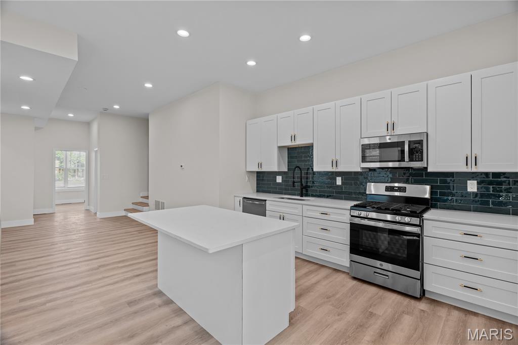 Beautifully renovated 2-story brick home offering the perfect combination of space, style, and modern updates! This spacious home features 4 bedrooms, 3 full bathrooms, and an open-concept main level that's perfect for everyday living and entertaining. The living room flows seamlessly into the dining area and stunning kitchen, complete with white cabinetry, stainless steel appliances, a stylish tile backsplash, and a large center island with plenty of prep space and seating.

The main level also includes a spacious bedroom and a fully renovated full bathroom, making it ideal for guests, a home office, or multi-generational living. Upstairs, you'll find three additional bedrooms, including a spacious primary suite with its own private, fully renovated en-suite bathroom. The second floor also features another fully renovated full bathroom conveniently located in the hallway, along with a laundry closet for added convenience.

All three bathrooms have been completely updated with new vanities, tile flooring, and modern finishes. Additional upgrades throughout the home include fresh paint, new windows, new interior and exterior doors, and luxury vinyl plank flooring, giving the home a bright, clean, contemporary feel.

Step outside to enjoy the fenced backyard featuring a spacious two-level deck that's perfect for relaxing or entertaining. The upper-level deck is covered, allowing you to enjoy the outdoor space rain or shine. The backyard also includes two off-street parking spaces for added convenience.

Conveniently located near shopping, dining, parks, and major highways, this move-in-ready home offers the space, comfort, and modern updates you've been looking for. Schedule your showing today and make this beautifully renovated home your next address!

Tenant is responsible for ALL utilities.

Don’t miss your chance—schedule your showing today!

NON-SMOKING/VAPING HOME!

12 MONTH LEASE REQUIRED