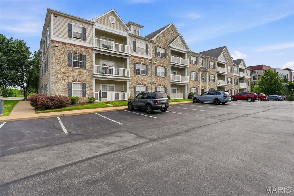 Showings begin Thurs, May 28
WELCOME HOME!
Experience easy, carefree living in this luxury 2-bedroom, 2-bath condo located in the heart of Chesterfield! Perfectly situated across from Chesterfield Amphitheater and Chesterfield Central Park — home to Veterans Honor Park, the Family Aquatic Center, and scenic walking trails — this location offers convenience, recreation, and entertainment right outside your door. Enjoy close proximity to popular restaurants, shopping, Topgolf Chesterfield, and quick access to Highway 64.

One of the standout features of this desirable 2nd-floor corner unit (elevator in building) is the covered deck overlooking peaceful green space and mature trees — the perfect place to relax and unwind.

Inside, you’ll love the neutral paint palette, updated flooring, abundant natural light, and open-concept layout. The inviting foyer leads into a spacious family room that serves as the heart of the home. The kitchen features 42” maple cabinets, stainless steel appliances, and a refrigerator that stays with the home.

The primary suite offers a large walk-in closet and private bath, while the second bedroom includes generous space and a custom closet shelving system for added organization. Additional updates include a new HVAC system, offering comfort and peace of mind for years to come. 
A private storage unit is also included, providing convenient extra space for seasonal items, hobbies, or additional belongings. Plus, enjoy the convenience of assigned, covered parking for one vehicle and in-unit laundry for added ease and functionality.

Highlights:

2nd-floor corner unit with elevator access
New HVAC system
In unit laundry
Covered deck with scenic views
Open floor plan with abundant natural light
42” maple cabinetry & stainless appliances
Spacious primary suite with walk-in closet
Excellent Chesterfield location near parks, dining, shopping & entertainment
Easy access to Hwy 64

A wonderful opportunity to enjoy low-maintenance living in one of Chesterfield’s most convenient locations!