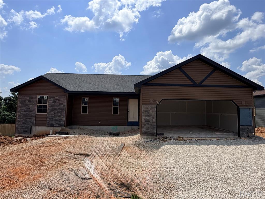 Welcome home to this Ozark model new construction home, with estimated completion of end of August 2026! Situated in the Summit Pass subdivision, just minutes from the West gate of Fort Leonard Wood, this home features an open concept living space, with luxury vinyl plank flooring throughout. In the kitchen, find granite counter tops, stainless steel appliances, along with custom cabinetry & soft close drawers. Living area provides access to the covered deck. The primary suite includes tile shower & glass door, as well as spacious walk-in closet. Main floor laundry is conveniently located off the garage. One additional bedroom & full bathroom round out the main floor. Downstairs, find a family room with access to the backyard, two bedrooms & bathroom, along with a large storage room. Main floor common bath and lower level bath both include tub/shower combo. Home includes spray foam insulation, Carrier heat pump HVAC system, solid surface flooring, Owens Corning shingles & insulated garage doors. One year Builder's Warranty included.