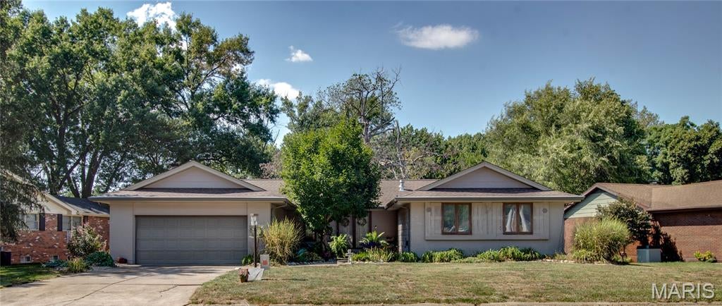 Spacious 5-Bedroom River Aire Home with Award-Winning Curb Appeal! Welcome to this impressive 5-bedroom, 3-bathroom home offering exceptional space, thoughtful updates, and an inviting layout designed for both everyday living and entertaining. The courtyard-style entryway creates a welcoming first impression, and the home’s appearance has earned a local award for the past 6 consecutive years—a true reflection of the pride of ownership. Enter into formal living/dining room with a vaulted ceiling accented by beautiful wood beams, adding warmth and character to the space. The main level also features 4 bedrooms with hard wood floors, including a spacious primary bedroom suite with a walk-in closet. The updated, open-concept kitchen and family room complete with a wood burning fireplace, provide the heart of the home, showcasing a large center island, granite countertops, a convenient microwave drawer, and a sliding door leading to an upper-level wood deck.  Large casement windows throughout the home bring in natural light, and an attached 2-car garage adds everyday convenience. The finished lower level expands the living space considerably, featuring a walkout to a covered patio, hot tub, and a large chain-link-fenced backyard. Inside, the updated basement offers a fifth bedroom, bathroom, large recreation room, family room, bar area, spacious laundry room, and 3 bonus rooms—providing plenty of flexibility for guests, hobbies, a home office, storage, or additional living needs. With its generous bedroom count, multiple gathering spaces, desirable outdoor amenities, and award-winning exterior, this home offers a rare combination of comfort, functionality, and character. A must-see property with room for everyone! Agent related to seller.
