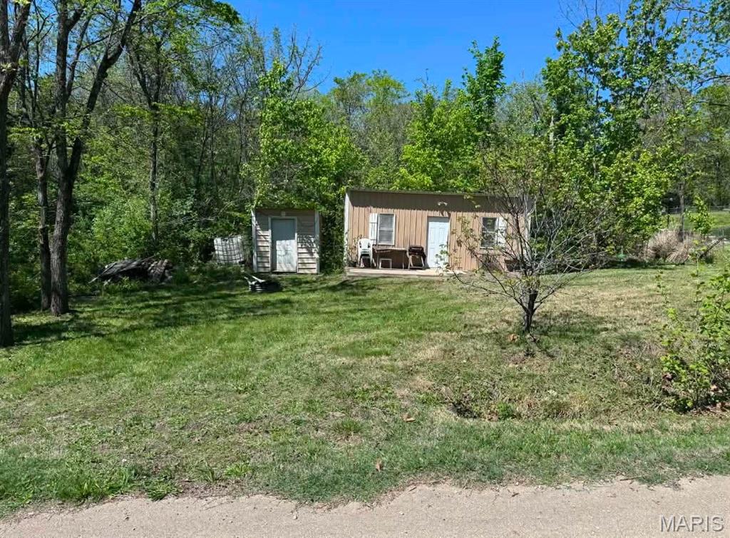 Almost .50-acre flat, level lot located within a gated lake community approximately one hour from St. Louis. An excellent opportunity to build your dream home, establish a weekend retreat, or bring your camper and begin enjoying lake living immediately. The property includes a small cabin ready for your finishing touches.
Conveniently situated near the beach, pool, boat ramp, and the many amenities Goose Creek has to offer, including a 450-acre lake, additional smaller lakes, a recreation hall, playgrounds, and miles of roads and trails for outdoor recreation. Bring your ATVs, golf cart, boat and recreational vehicles to enjoy fishing, boating, swimming, and peaceful relaxation within this private community setting.