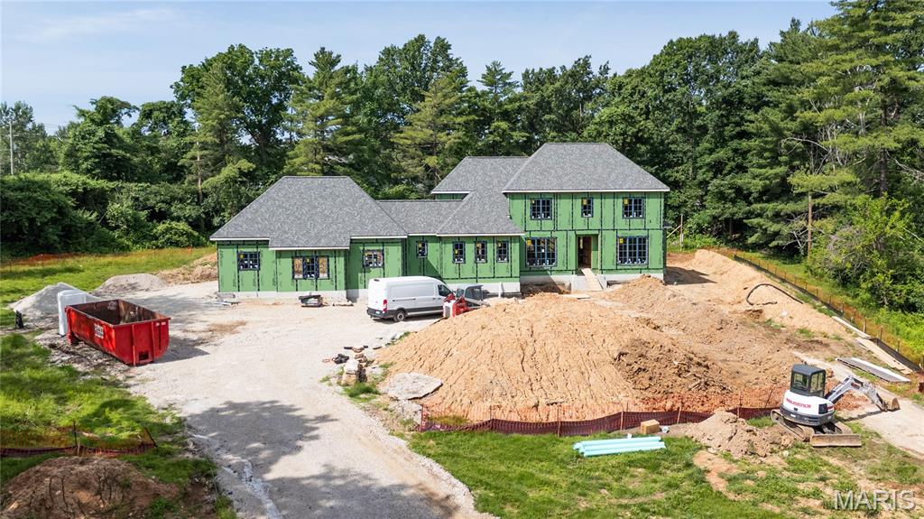 Under construction by premier builder Slavin Homes. This rare opportunity in the heart of Town & Country is located on a picturesque and private one+ acre lot. Slavin Homes, known for timeless craftsmanship and meticulous attention to detail, is building this 6000+ total sq ft home that will feature 10 ft. 1st floor ceilings, 9 ft. 2nd floor ceilings, a luxurious primary suite, rich hardwood flooring and extensive millwork throughout. Custom-designed cabinetry and high-end finishes, convenient main and second-floor laundry rooms, and rear entry, three-car garage with ample storage make this home a showstopper. This upscale home reflects your style, functionality, and future—all in one of the most sought-after communities. Don’t miss this rare opportunity!