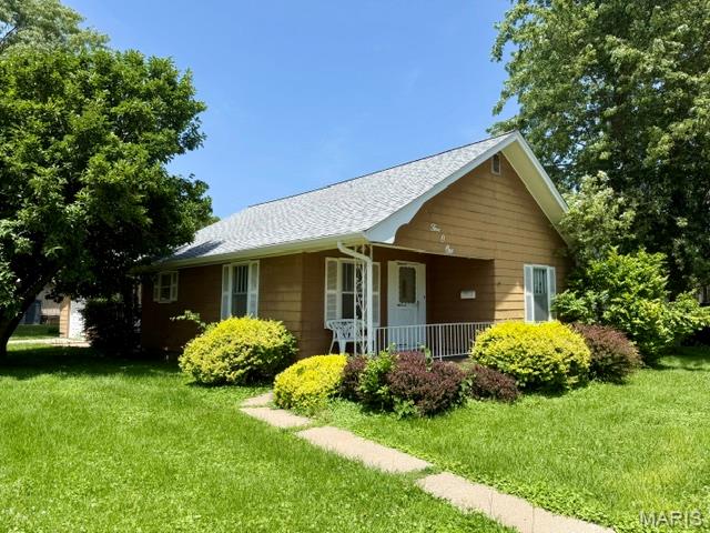 Stop in and take a look at 501 E US Hwy 54 in Vandalia.  This 2 bed, 1 bath home has a new roof and gutters! A great start to bringing this home back to the beauty it once was. The cute front porch is just a hint of the charm this place has to offer. The 1 car attached garage has enough space for a small work space and the adjoining room between the house and garage is a great area for a family room. Both bedrooms are spacious and there are large closets.  Whether you're an investor or a buyer looking to create your dream home, this fixer-upper offers endless possibilities. Bring your vision, roll up your sleeves, and transform this property into something special. Property is being sold as is.