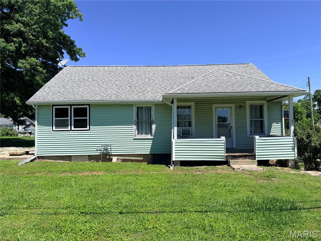 This 2 bedroom, 1 bath home is located on a corner lot in the charming river town of Kampsville along the Illinois River. This home offers character, some updates and plenty of opportunity to make it your own. Improvements include kitchen updates, newer countertops, select newer windows, some updated lighting etc. There is original hardwood flooring through much of the home. 
One of the properties standout features is it's located outside of the floodplain, offering added peace of mind while still being close to all the recreation and beauty that the Illinois River has to offer. The enclosed carport provides additional convenience. A few finishing touches remain, allowing the next owner to add their personal style and build additional value over time.
Whether you're looking for a starter home, investment property or weekend retreat, this property is full of potential. Being sold As-Is.