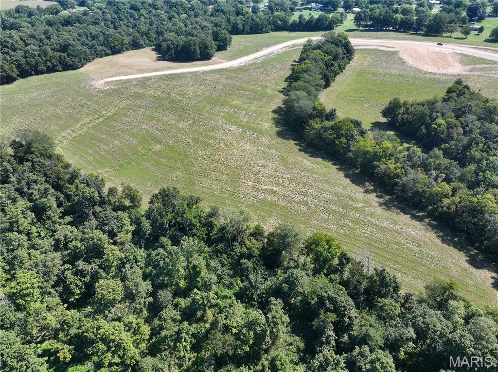 Looking for a secluded country setting with room to spread out? This 20± acre tract in Kinder Farms Subdivision offers the space and privacy to create your own country retreat just outside Jackson, Missouri. A combination of open ground and mature timber provides numerous possibilities for a private homesite, pasture, hobby farm, recreation, or simply room to enjoy the outdoors. Livestock, horses, and outbuildings are permitted, giving you the flexibility to make the property your own. Electric and water are available, and you can bring your own builder. Light restrictions will apply. Approximately 3 miles from Jackson Schools, this property offers the privacy of acreage with the convenience of being close to Jackson.

A survey will be completed prior to closing to determine the exact acreage. Final purchase price will be based on the surveyed acreage and the agreed-upon price per acre.