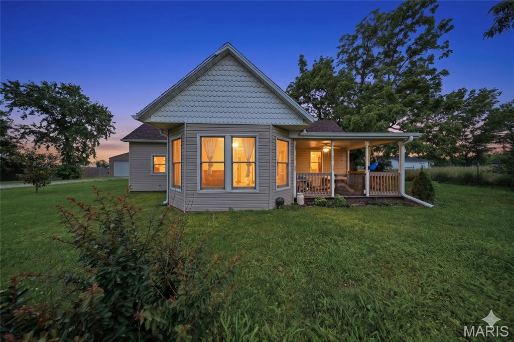 Welcome to country living!  This charming 3-bedroom, 1-bathroom home has modern updates.  The hearth room boasts a cozy free-standing wood stove. The kitchen  offers custom cabinetry, granite countertops, sleek stainless steel appliances, and a generous pantry. Relax on the covered front porch or impressive deck overlooking the backyard with a firepit, greenhouse, and fruit trees.  A 2-car detached 30x40 workshop/garage with oversized overhead is ideal for your outdoor storage or projects. Don't miss this one! Schedule your private tour today!