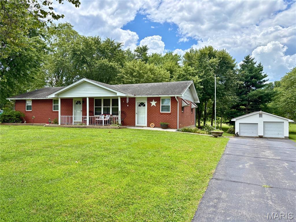 Brick ranch on 1.128 acres in Jackson R-II School District offering the space, storage, and shop setup buyers are looking for. With 4 bedrooms, 2.5 baths, multiple living areas, and both attached and detached garage space, this property is well suited for buyers needing room for vehicles, hobbies, tools, equipment, or storage.

The main level includes 3 bedrooms, 1.5 baths, an eat-in kitchen, living room, and large family room with buck stove. Hardwood flooring is believed to be under portions of the main-level floor coverings, with closet floors offering a glimpse of what may be underneath. The walk-out lower level adds a finished sleeping area/bedroom, full bath, laundry, and storage.

Outside, the expansive driveway provides easy access to both attached and detached garage spaces, including a heated shop with electricity, double doors, and one oversized bay. The carport currently serves as a covered patio, adding usable outdoor space without sacrificing parking flexibility. Updates include HVAC in 2020 and water heater in 2019. Brick exterior offers added sound buffering and efficiency-minded insulation benefits.

Home is no longer owner-occupied, so limited information is available; however, seller is not aware of concerns and resided here from 1978 until recently. Properties with this combination of acreage, brick construction, garage/shop space, and Jackson schools deserve a closer look.
