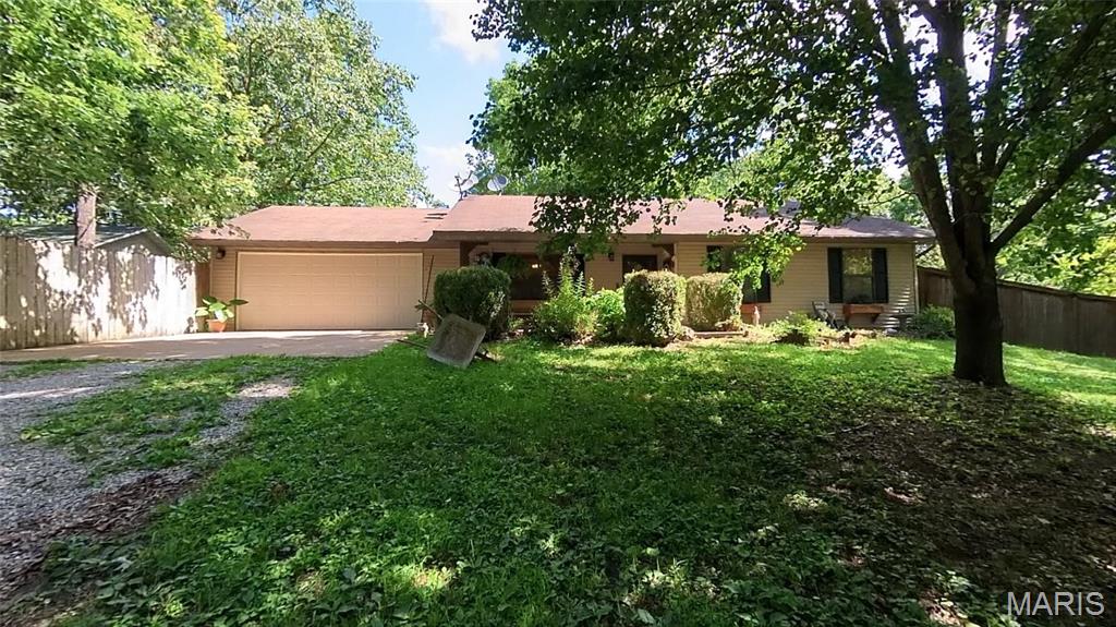 3-bedroom, 1.5-bath ranch-style home. Comes with a new Roof $12,000 allowance. Contract with Jackson Termite, smart light bulbs, Custom woodwork in the Kitchen with built-ins. New garage door. Main storage shed, Coy pond w/waterfall, mature shade trees, newer flooring. Antique ceiling stamped tin, updated kitchen faucet. New Patio. This home has lots of little extras. Country living on the edge of town. Just a smidge off the black top! This home will pass any kind of gov loan. It's super cute. Lots of Privacy with a long driveway and mature shade trees. Lots of nature to view.