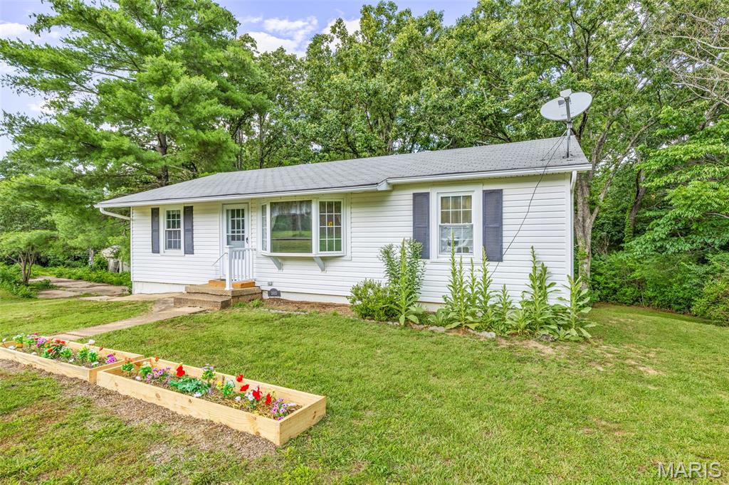 This charming home offers a blend of comfort and potential.  With 3 bedrooms, 1 bathroom, and an inviting living space, this home is waiting for your personal touches. Sitting on 4+/- acres, this property provides endless possibilities for gardening, gatherings, or expanding the living space.  An additional electric meter on the property provides convenience for any additional projects you may have in mind.  Whether you're looking to update the current features or maintain its classic charm, this home invites you to explore the possibilities.  Home is being sold as-is.