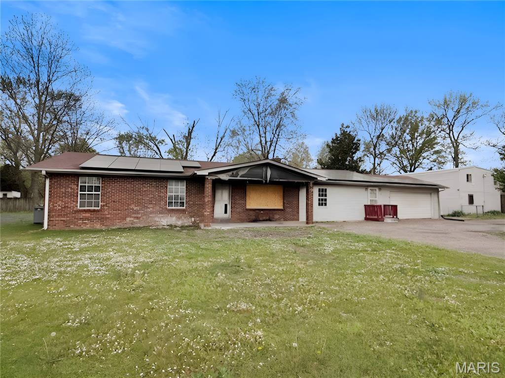 This single-story ranch home sits on a generous lot with good structural bones. The functional layout provides convenient one-level living with room to make it your own.

This three-bedroom, two-bathroom home presents exceptional investment potential with multiple income-generating opportunities. The property includes a separate two-bedroom, one-bathroom apartment ideal for rental income or extended family use, plus a substantial 30x40 workshop for various commercial or storage needs.

Located outside city limits with convenient paved highway frontage and a circular driveway, the property offers both accessibility and privacy. Solar panels provide ongoing energy cost savings, while the enclosed garage offers potential for additional living space conversion.

The combination of residential and commercial possibilities, along with the existing infrastructure and strategic location, creates a unique opportunity for investors or buyers seeking a property with diverse revenue streams and significant renovation potential in a rural setting.

Contact us today to schedule a viewing of this ranch home with solid bones and explore the possibilities this property and location have to offer.

This is a Fannie Mae HomePath property.

First Time Buyers, complete the HomePath Ready Buyer homeownership course on Homepath.com. Attach certificate to offer up to 3% closing cost assistance. Check HomePath.com for more details. Restrictions apply.