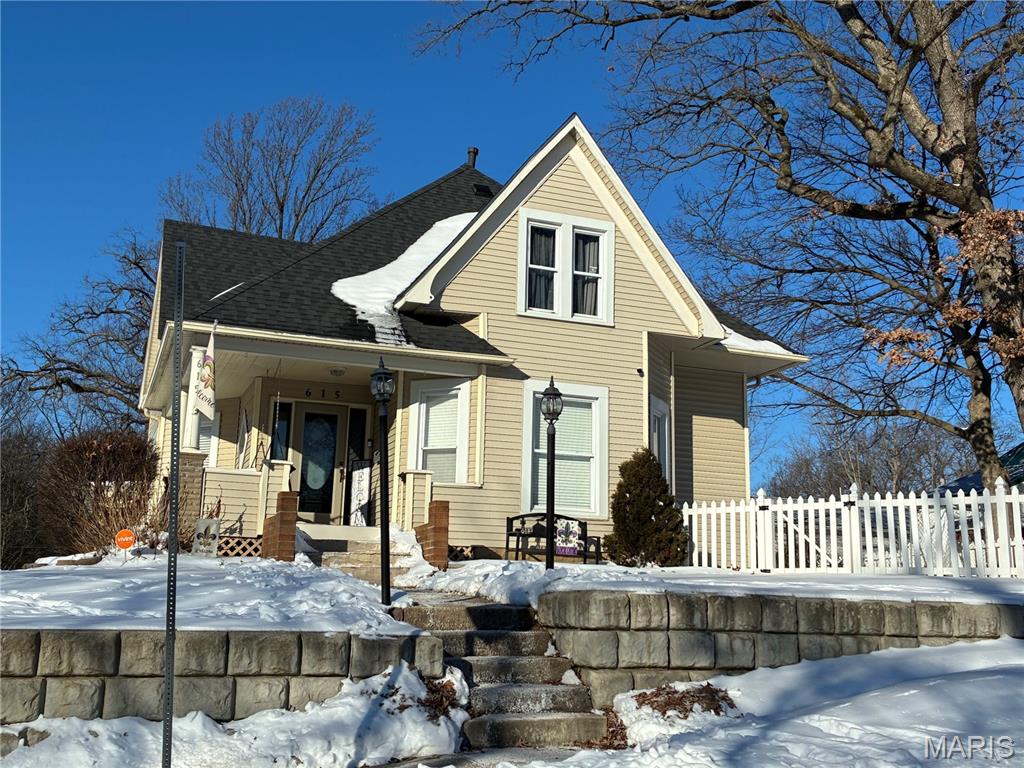 Looking for character, charm and woodwork, see this historical home on a hill near Greenville University.  Features a rear deck, carport, and solid wood. Beautiful wood staircase leads to 3 good size bedrooms, recently remodeled bathroom. Large storage room next to the bathroom. Enjoy the spacious room on the main floor. The house includes updates to a recent roof (2024), flooring in the bedrooms. Doors in the kitchen including a Shaker door, storm door and sliding patio doors. Interior is freshly painted with updated lighting.